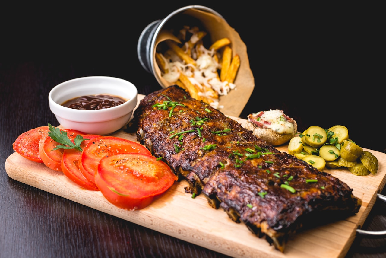 Diners grilling marinated beef on a built-in tabletop grill at 888 Korean BBQ